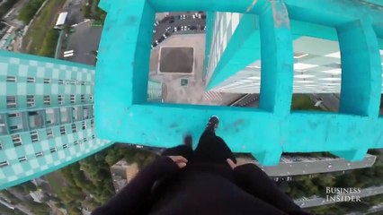 Watch Russian adrenaline junkies perform daring tricks atop a 40-story building