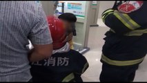 Firemen free boy's fingers from door