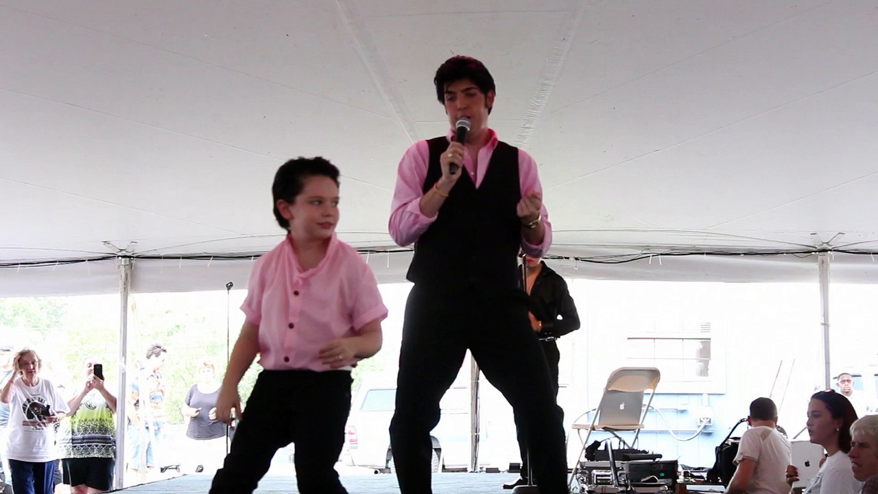 Austin Irby sings 'Rock A Hula Baby' as a kid dances Elvis Week 2015