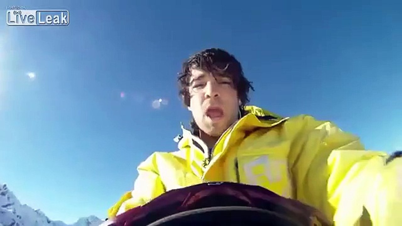 skier falls off cliff putting skis on