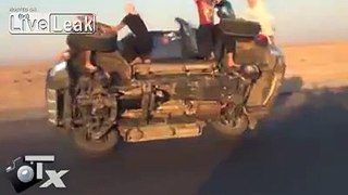 insane!!... changing two tires while driving in Saudi arabia