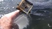 Guy searches a river and finds iPhones, GoPros and food!