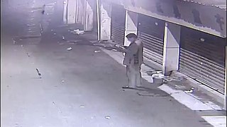 Man pours bucket of shit in front of store