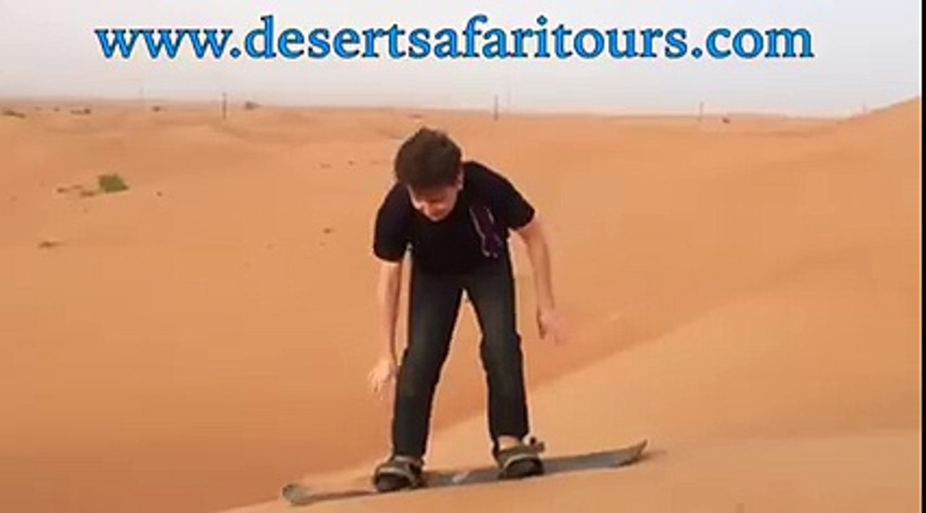 Mr. Bert from England Trying Sand Boarding - Desert Safari Tours