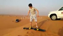 Mr. Kai Enjoying Sand Boarding - Desert Safari Tours