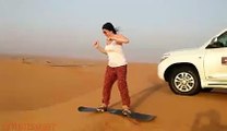 Mrs. Allison Enjoying Sand Boarding - Desert Safari Tours