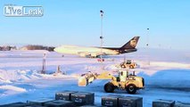 Ted Stevens Airport -- Snow Day ... Cargo Companies Takeoff in Snow