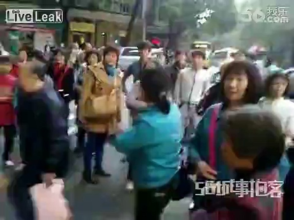 Guy beating wife in street makes bystanders angry