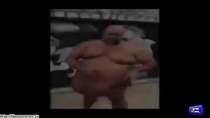 Fat man hides gun beneath his skin.