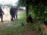 Mexican Police Using a Water Cannon on a Prisoner