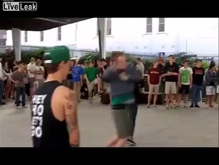 Guy gets kicked in the balls by dancing midget