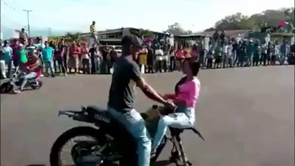 Amazing Bike one wheeling in crowd