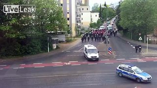 Ridiculous football fans escorted by ridiculous amount of police men