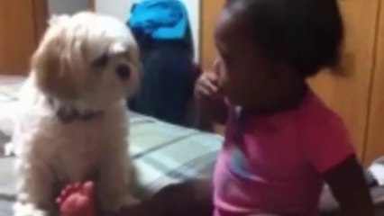 Cute baby playing and kissing the cute dog