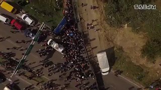LiveLeak.com - Drone Footage Shows Hundreds of Refugees Blocked at Hungarian Border