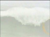 RAW: Brazilian Surfer | Surfer Carlos Burle Rides Colossal Wave in Portugal