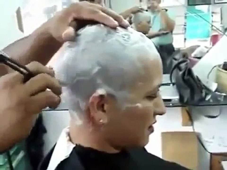 girl head shave in barber shop