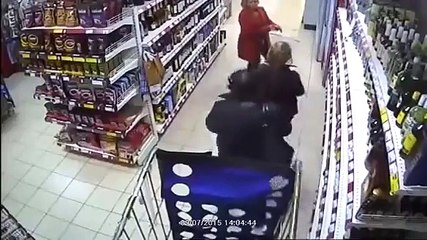Girls in panties hid bottles of alcohol. Theft in supermarket