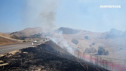 Firefighting plane swoops low over California wildfires