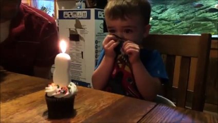 little boy can't blow out candle