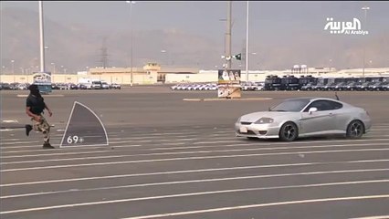 Saudi military  jump a car to avoid being hit