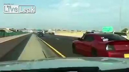 LiveLeak.com - Car club shuts down Interstate 25 for donut show