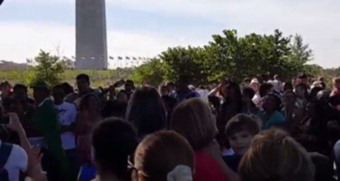 Onlookers on Motorcade Route Greet Pope Francis With Song