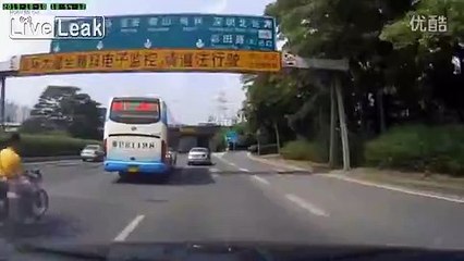 Man and cylinder fall off motorbike on road