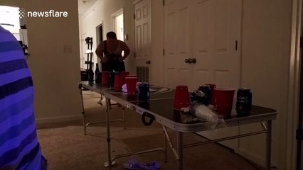 Man attempts audacious table slide... Fails horribly