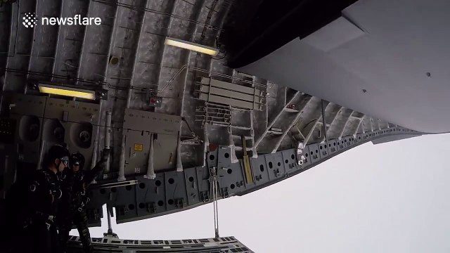 Awesome footage of paratroopers skydiving into the clouds