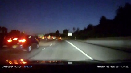 Cyclist rides tall bike down middle of US freeway