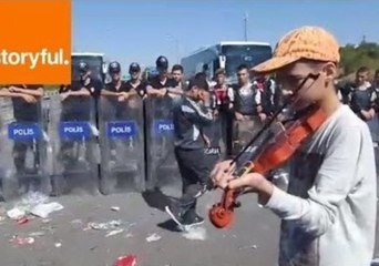 Syrian Refugee Plays Violin Near Police Barricade