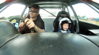 Excited Little Boy in a Rally Car