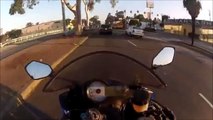 Crazy biker crossing at red light... Almost killed
