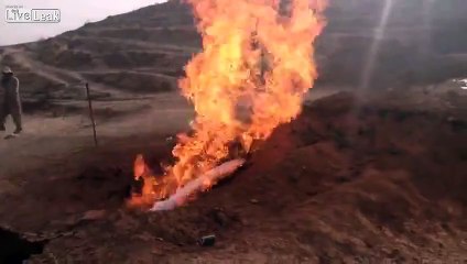LiveLeak.com - cold fresh water come out from underground with fire..