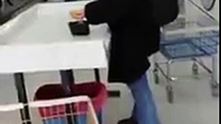 Woman Wearing Bike Helmet Acting Crazy In A Laundromat