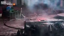 LiveLeak.com - Protesters use mobile toilets to shield against flash grenades and gas canisters during violent protests in Kiev