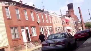 Idiot(nutjob) attacks car then knocks himself out.