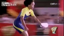Asian girl roller skates under vehicles.