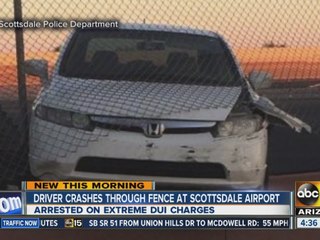 Driver crashes through fence at Scottsdale airport
