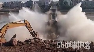 Amazing footage of an excavator taking down an entire bridge