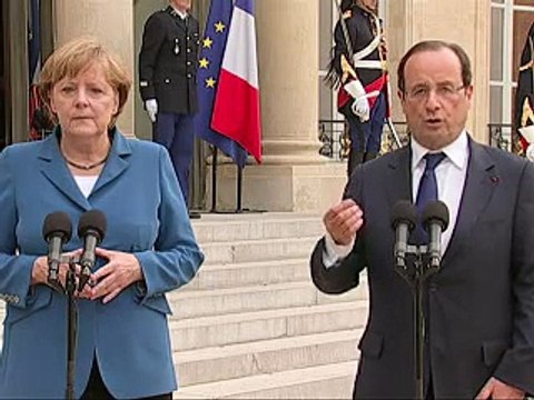 Merkel et Hollande se concertent à la veille du sommet européen, l'Espagne vacille