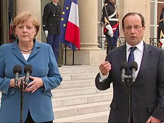 Merkel et Hollande se concertent à la veille du sommet européen, l'Espagne vacille