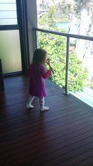 Precious toddler pretends to blow bubbles