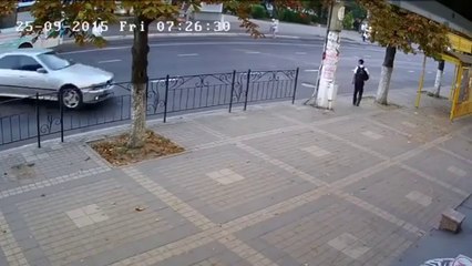 RAW: School Boy Escapes After Car Crashes Into Pole On Sidewalk Moments After He Walks Away
