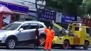 Chinese Woman Fights Back Against Car Towwing