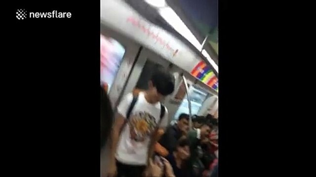 Man bursts into tears after boyfriend proposes on Beijing Tube