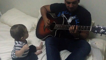 Baby Funny Reaction To Playing Guitar