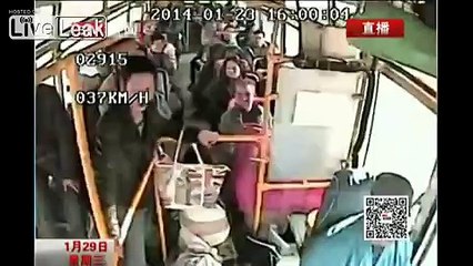 Crazy asshole on a bus grabs the wheel and nearly kills a Motorbike rider
