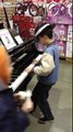 Little Kid Amazes Costco Shoppers with His Impromptu Piano Performance